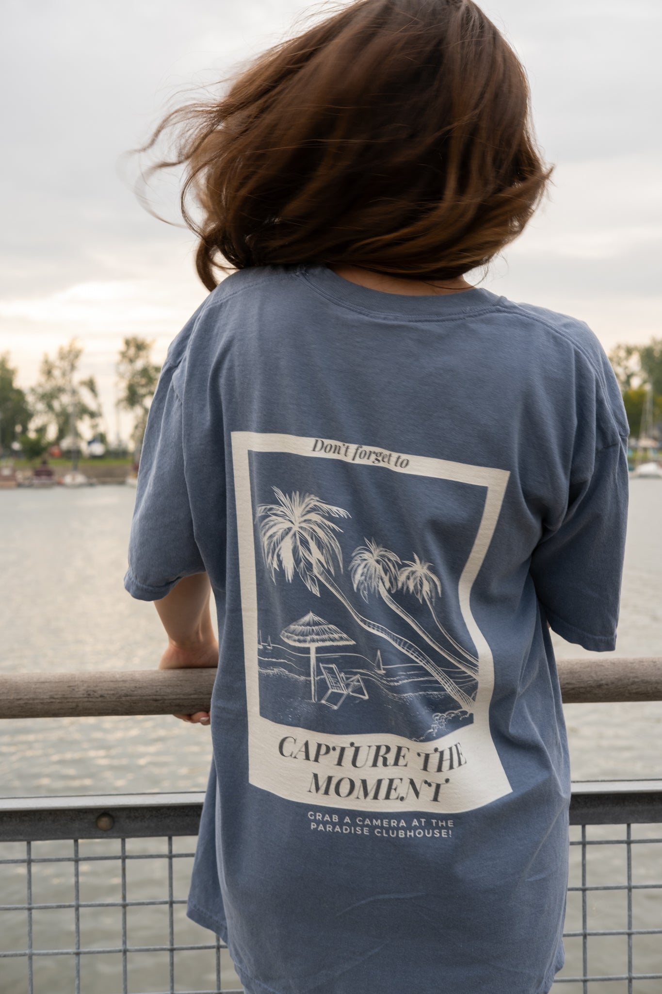 girl wearing a capture the moment polaroid film photography oversized aesthetic shirt for small business raye of happiness